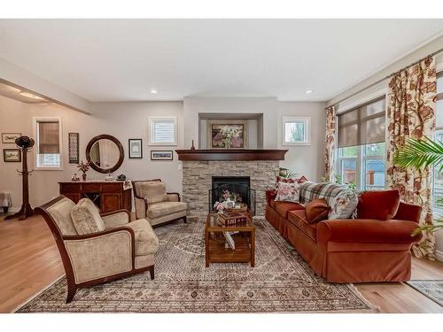 182 Cranarch Place Se, Calgary, AB - Indoor Photo Showing Living Room With Fireplace