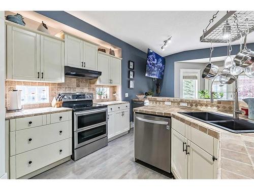 37 Rowland, Okotoks, AB - Indoor Photo Showing Kitchen With Double Sink