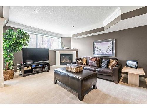 37 Rowland, Okotoks, AB - Indoor Photo Showing Living Room With Fireplace