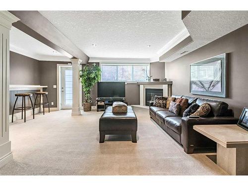 37 Rowland, Okotoks, AB - Indoor Photo Showing Living Room With Fireplace