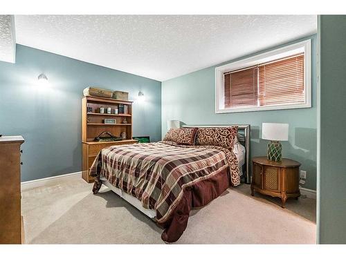 37 Rowland, Okotoks, AB - Indoor Photo Showing Bedroom