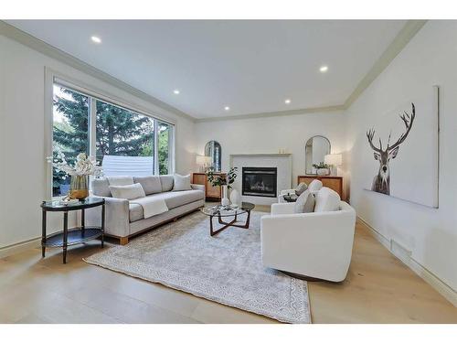 11 Aspen Ridge Lane Sw, Calgary, AB - Indoor Photo Showing Living Room With Fireplace