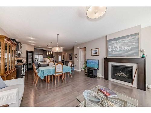 33 Fireside Landing, Cochrane, AB - Indoor Photo Showing Living Room With Fireplace