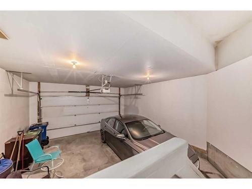 33 Fireside Landing, Cochrane, AB - Indoor Photo Showing Garage