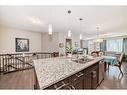 33 Fireside Landing, Cochrane, AB  - Indoor Photo Showing Kitchen With Double Sink With Upgraded Kitchen 