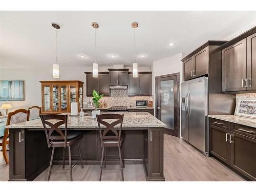 33 Fireside Landing, Cochrane, AB - Indoor Photo Showing Kitchen With Upgraded Kitchen