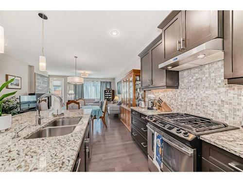 33 Fireside Landing, Cochrane, AB - Indoor Photo Showing Kitchen With Double Sink With Upgraded Kitchen