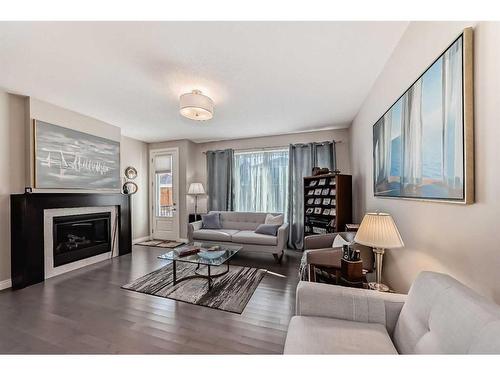 33 Fireside Landing, Cochrane, AB - Indoor Photo Showing Living Room With Fireplace