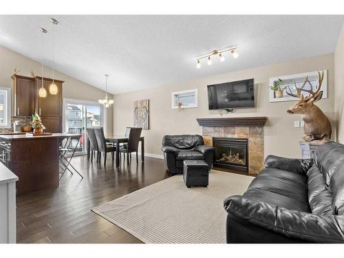 95 Valarosa Drive, Didsbury, AB - Indoor Photo Showing Living Room With Fireplace