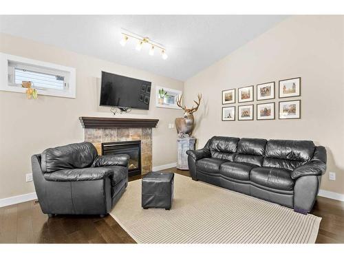 95 Valarosa Drive, Didsbury, AB - Indoor Photo Showing Living Room With Fireplace