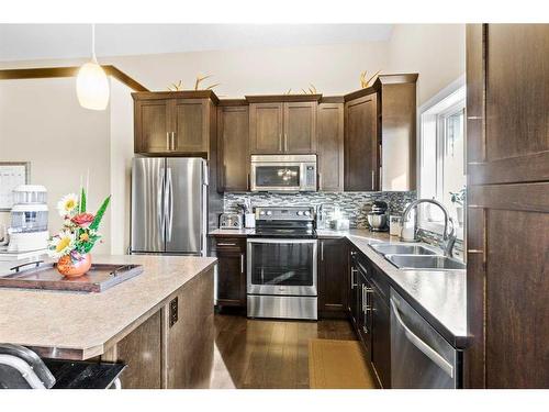 95 Valarosa Drive, Didsbury, AB - Indoor Photo Showing Kitchen With Double Sink With Upgraded Kitchen