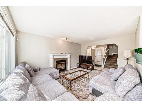 275 Taravista Street Ne, Calgary, AB - Indoor Photo Showing Living Room With Fireplace