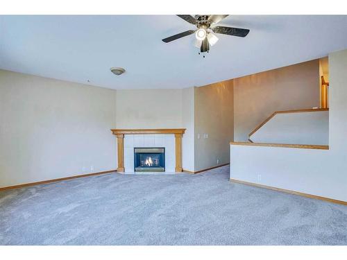 3626 Douglas Ridge Boulevard Se, Calgary, AB - Indoor Photo Showing Living Room With Fireplace