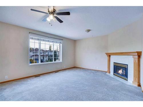 3626 Douglas Ridge Boulevard Se, Calgary, AB - Indoor Photo Showing Living Room With Fireplace