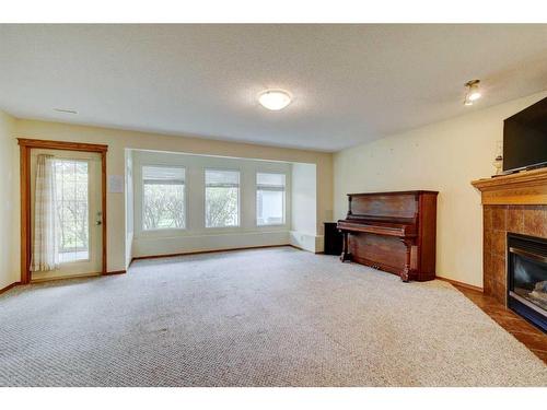 159 Gleneagles View, Cochrane, AB - Indoor With Fireplace