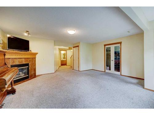 159 Gleneagles View, Cochrane, AB - Indoor With Fireplace