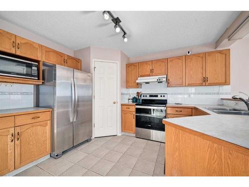 710 Martindale Boulevard Ne, Calgary, AB - Indoor Photo Showing Kitchen With Double Sink