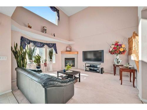 710 Martindale Boulevard Ne, Calgary, AB - Indoor Photo Showing Living Room With Fireplace