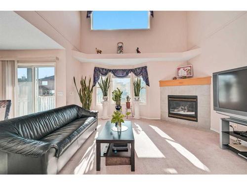 710 Martindale Boulevard Ne, Calgary, AB - Indoor Photo Showing Living Room With Fireplace