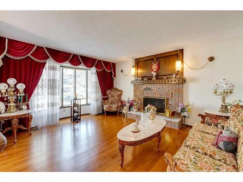 311 Temple Close Ne, Calgary, AB - Indoor Photo Showing Living Room With Fireplace