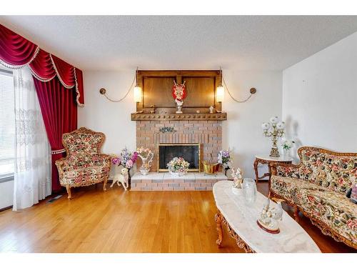 311 Temple Close Ne, Calgary, AB - Indoor Photo Showing Living Room With Fireplace