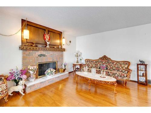 311 Temple Close Ne, Calgary, AB - Indoor Photo Showing Living Room With Fireplace