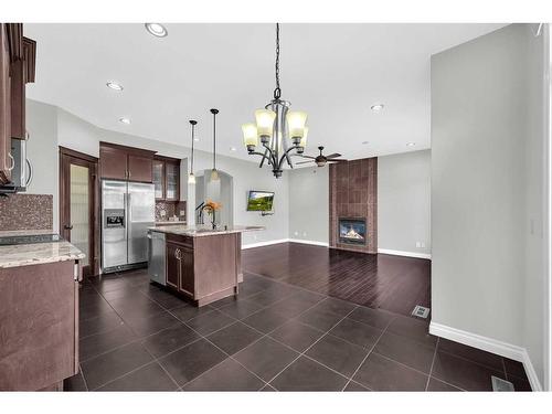 129 Saddlelake Green Ne, Calgary, AB - Indoor Photo Showing Kitchen With Fireplace