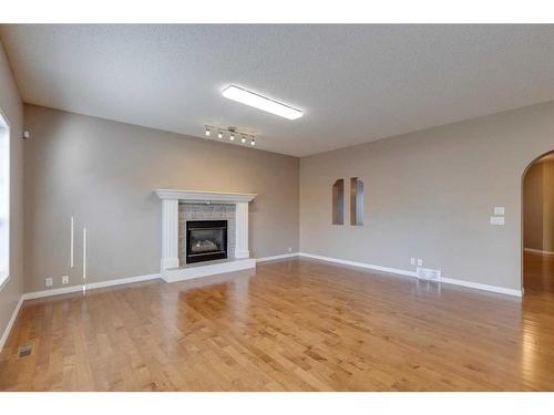 10349 Tuscany Hills Way Nw, Calgary, AB - Indoor Photo Showing Other Room With Fireplace