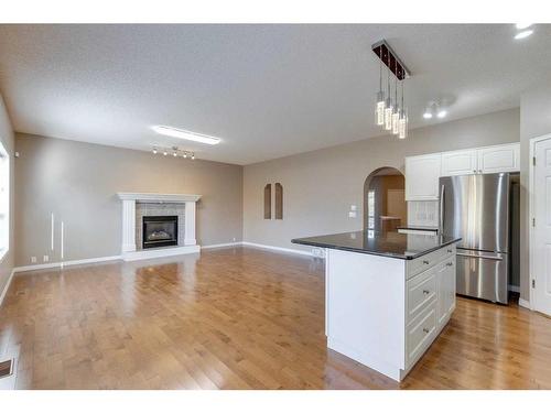 10349 Tuscany Hills Way Nw, Calgary, AB - Indoor Photo Showing Kitchen With Fireplace