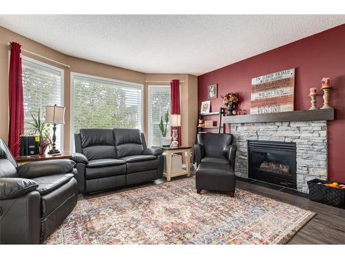 288 Cramond Close Se, Calgary, AB - Indoor Photo Showing Living Room With Fireplace