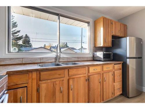 55 Margate Place Ne, Calgary, AB - Indoor Photo Showing Kitchen With Double Sink