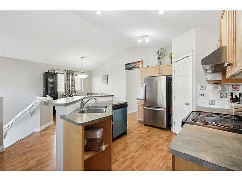 1056 Bridlemeadows Manor Sw, Calgary, AB - Indoor Photo Showing Kitchen With Double Sink