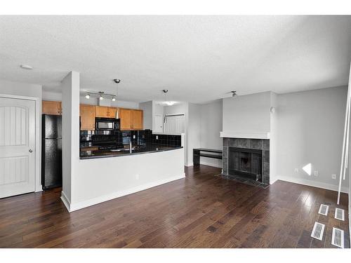 5-207 Village Terrace Sw, Calgary, AB - Indoor With Fireplace