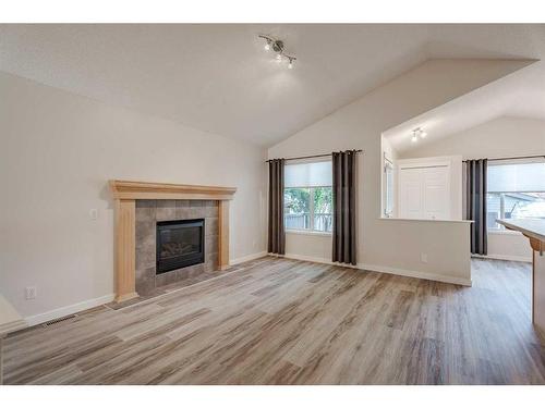 119 Sagewood Grove Sw, Airdrie, AB - Indoor Photo Showing Living Room With Fireplace