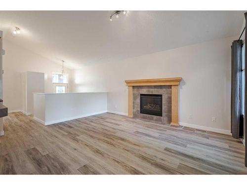 119 Sagewood Grove Sw, Airdrie, AB - Indoor Photo Showing Living Room With Fireplace