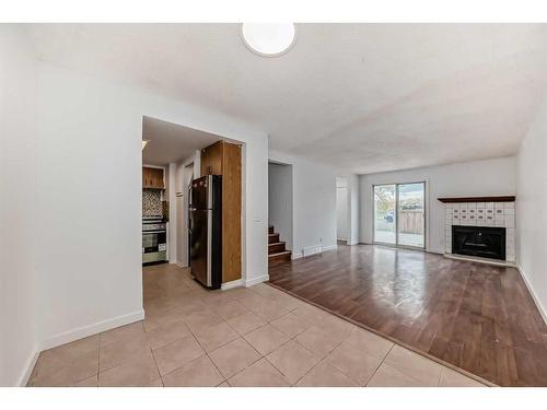 101-5404 10 Avenue Se, Calgary, AB - Indoor With Fireplace