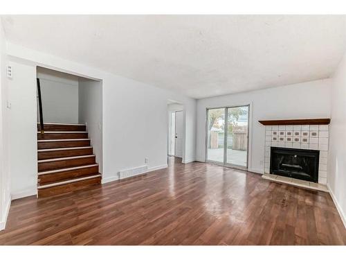 101-5404 10 Avenue Se, Calgary, AB - Indoor Photo Showing Living Room With Fireplace