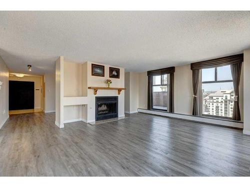 2201-1100 8 Avenue Sw, Calgary, AB - Indoor Photo Showing Living Room With Fireplace