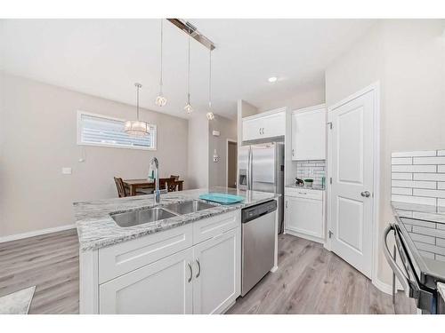 84 Legacy Glen Street Se, Calgary, AB - Indoor Photo Showing Kitchen With Stainless Steel Kitchen With Double Sink With Upgraded Kitchen