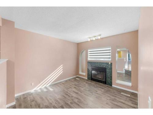 80 Costa Mesa Close Ne, Calgary, AB - Indoor With Fireplace