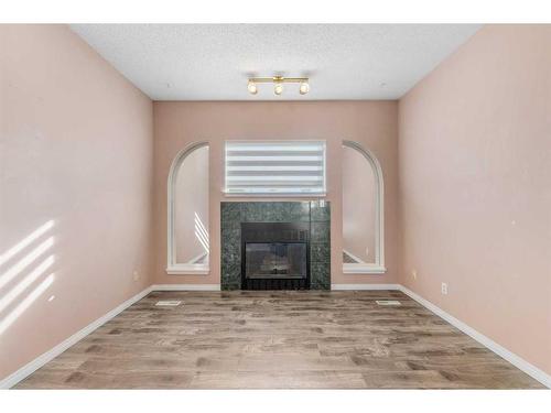 80 Costa Mesa Close Ne, Calgary, AB - Indoor With Fireplace