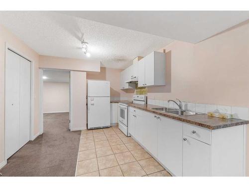 80 Costa Mesa Close Ne, Calgary, AB - Indoor Photo Showing Kitchen With Double Sink