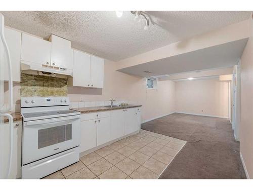 80 Costa Mesa Close Ne, Calgary, AB - Indoor Photo Showing Kitchen With Double Sink