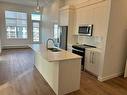 1516-395 Skyview Parkway Ne, Calgary, AB  - Indoor Photo Showing Kitchen With Double Sink 