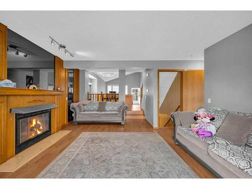 112 Whitehaven Crescent Ne, Calgary, AB - Indoor Photo Showing Other Room With Fireplace