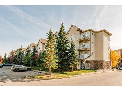 201-2000 Applevillage Court Se, Calgary, AB - Outdoor With Balcony With Facade