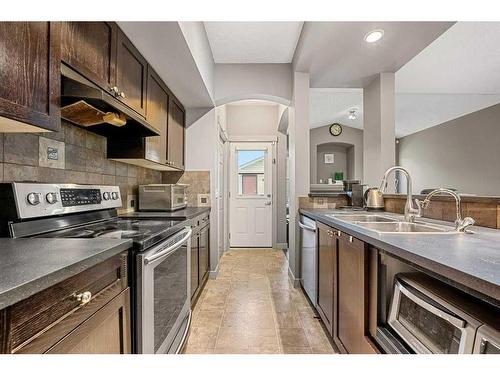 212 Silverado Range Close Sw, Calgary, AB - Indoor Photo Showing Kitchen With Double Sink