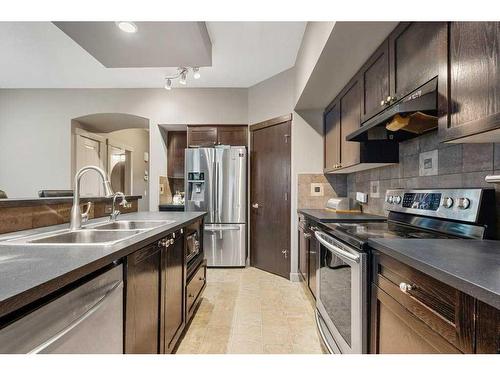 212 Silverado Range Close Sw, Calgary, AB - Indoor Photo Showing Kitchen With Double Sink