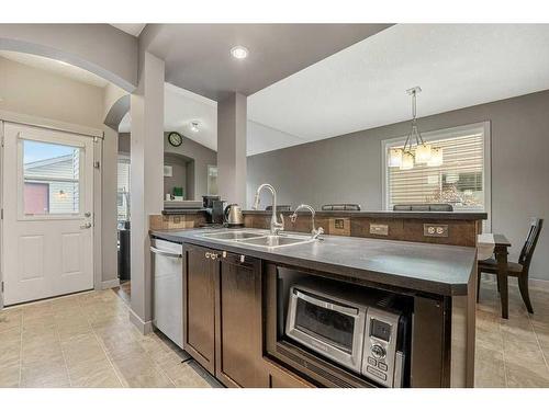 212 Silverado Range Close Sw, Calgary, AB - Indoor Photo Showing Kitchen With Double Sink