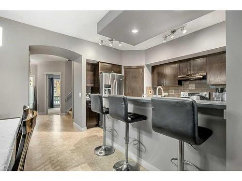 212 Silverado Range Close Sw, Calgary, AB - Indoor Photo Showing Kitchen With Upgraded Kitchen